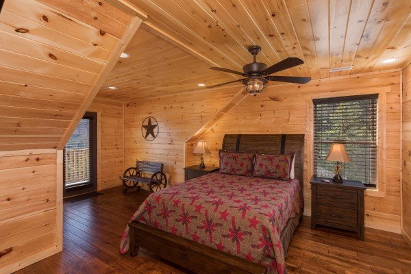 Bedroom with a queen bed on the second floor at Gonzo's Outpost, a 3-bedroom cabin rental located in Pigeon Forge