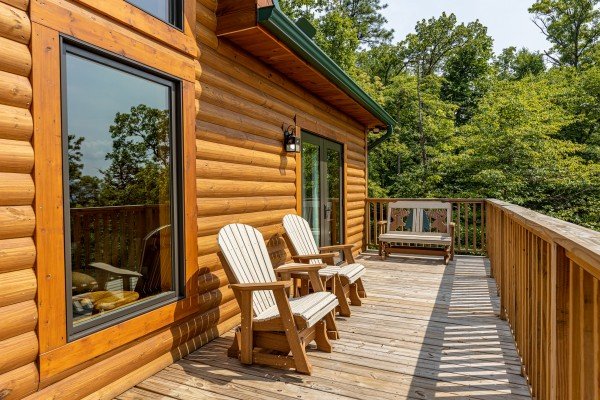 Adirondack chairs and bench at J's Hideaway, a 4 bedroom cabin rental located in Pigeon Forge
