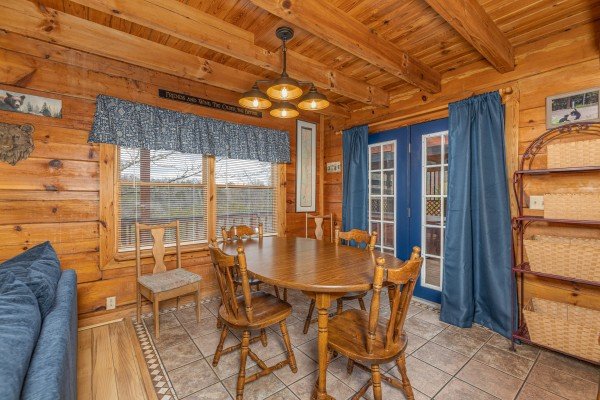 Dining table for four at Leconte Nirvana, a 3 bedroom cabin rental located in Pigeon Forge