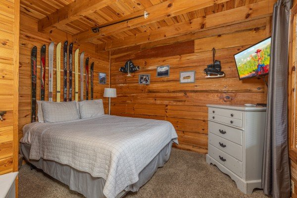 Bedroom with dresser and TV at Leconte Nirvana, a 3 bedroom cabin rental located in Pigeon Forge