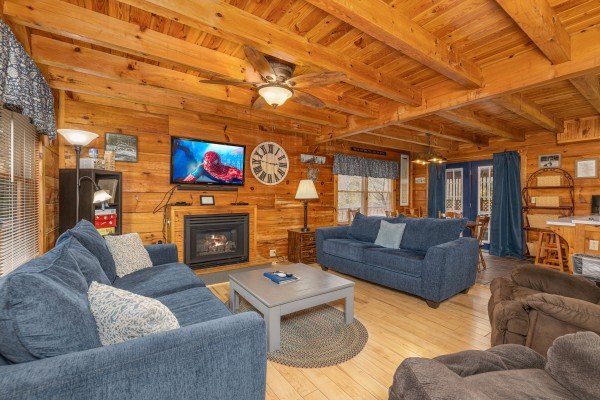 Living room with fireplace and TV at Leconte Nirvana, a 3 bedroom cabin rental located in Pigeon Forge