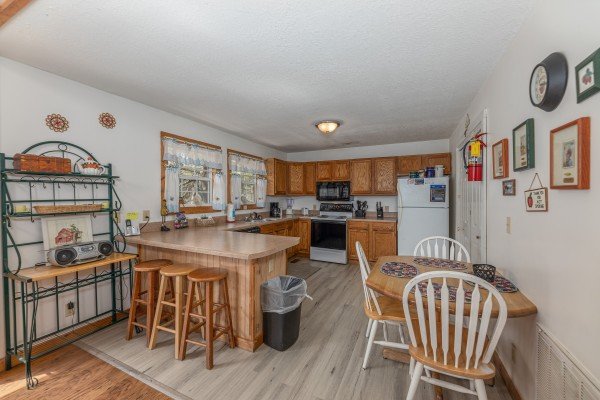 Kitchen and dining space at Bear it All, a 2 bedroom cabin rental located in Sevierville