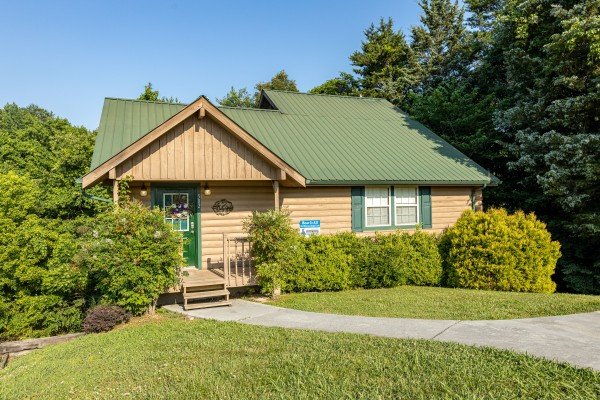 Front exterior view and paved parking at Bear it All, a 2-bedroom cabin rental located in Sevierville.