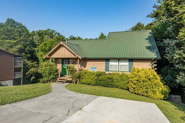 Front exterior view with paved parking at Bear It All, a 2 bedroom cabin rental located in sevierville