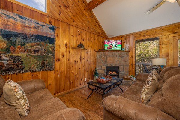 Living room fireplace at Bear it All, a 2-bedroom cabin rental located in Sevierville.
