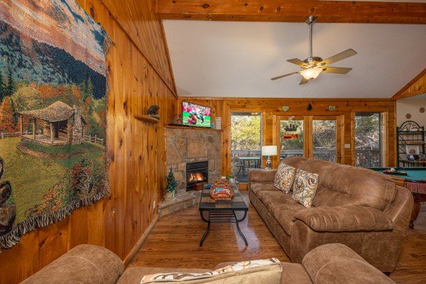 Living room with tapestry at Bear it All, a 2-bedroom cabin rental located in Sevierville. 