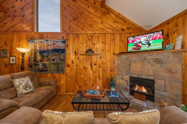 Living room with vaulted ceiling at Bear it All, a 2-bedroom cabin rental located in Sevierville.