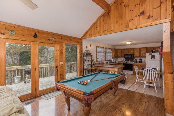 Pool table in the living room at Bear it All, a 2-bedroom cabin rental located in Sevierville