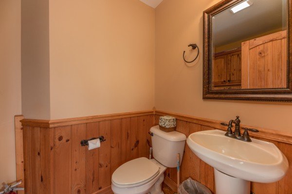 Half bath at Mountain Lake Getaway, a 3 bedroom cabin rental located at Douglas Lake