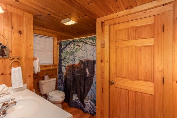 Bathroom with a tub and shower at Wonders in the Sky, a 3 bedroom cabin rental located in Gatlinburg