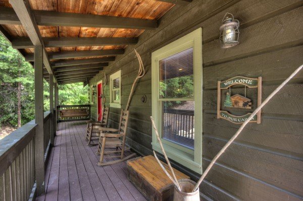 Welcoming front porch with rocking chairs at Wonders in the Sky, a 3 bedroom cabin rental located in Gatlinburg