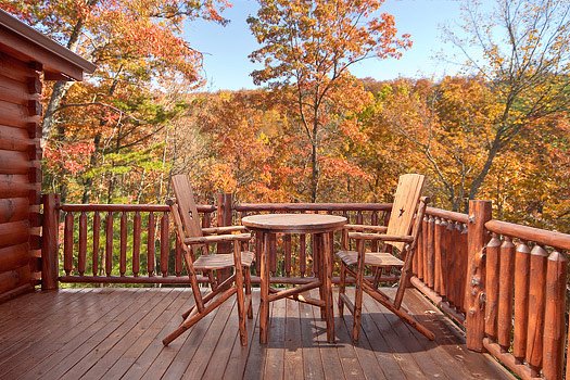 Patio table and chairs on deck at Looky Yonder, a 2 bedroom cabin rental located in Gatlinburg