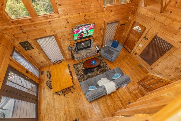Living room view from loft at Smokies Serenity, a 2 bedroom cabin rental located in Douglas Lake