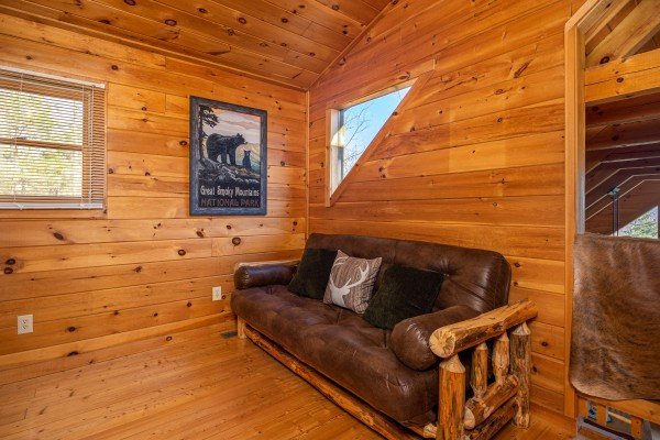 Log couch at The Roost, a 2 bedroom cabin rental located in Pigeon Forge