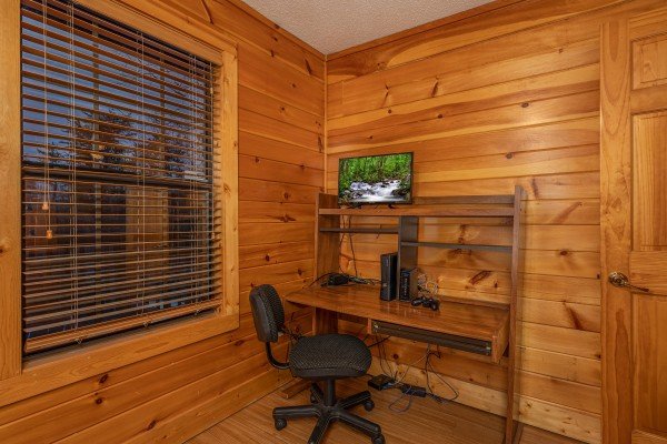 Computer desk with TV at Pine Splendor, a 5 bedroom cabin rental located in Pigeon Forge