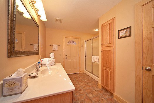 Bathroom with shower connected to bedroom at Horse'n Around, a 3 bedroom cabin rental located in Pigeon Forge
