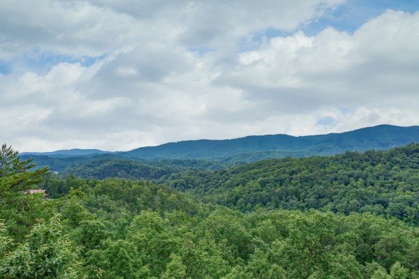The beautiful Smoky Mountain view from the deck at Horse'n Around, a 3 bedroom cabin rental located in Pigeon Forge