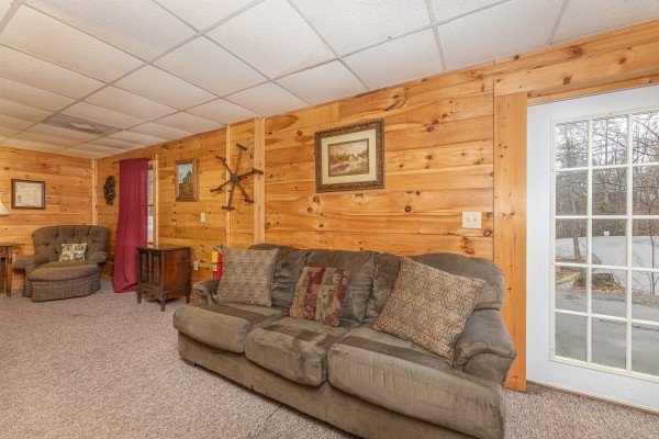 Game room sofa at Fox Ridge, a 3 bedroom cabin rental located in Pigeon Forge