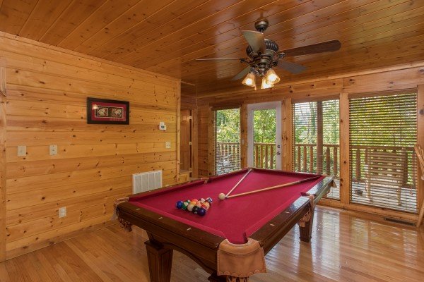 Pool table in the game room at Kick Back & Relax! A 4 bedroom cabin rental located in Pigeon Forge
