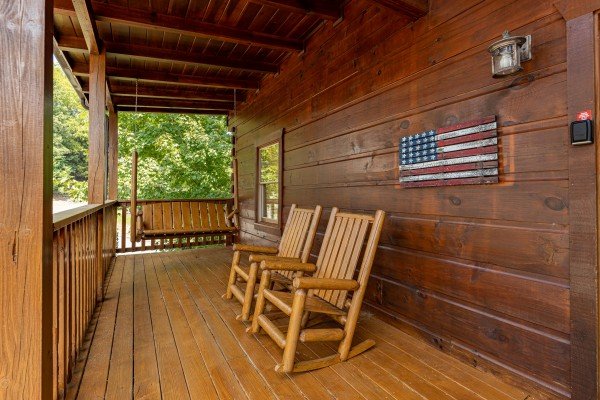 Swing and rocking chairs at Livin' Simple, a 2 bedroom cabin rental located in Pigeon Forge