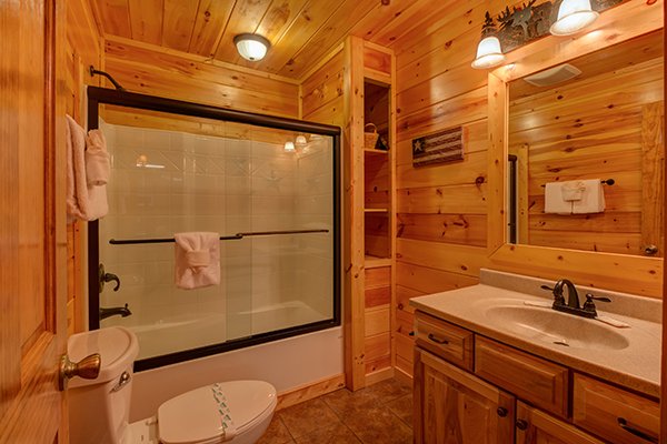 Bathroom with a tub and shower at Rustic Romance, a 2 bedroom cabin rental located in Pigeon Forge