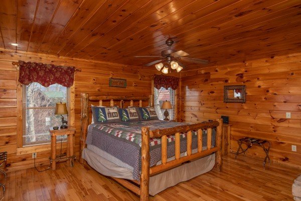 Bedroom with a king log bed at 5 Star View, a 3 bedroom cabin rental located in Gatlinburg