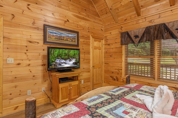 TV in a bedroom at Location Location Location, a 1 bedroom cabin rental located in Pigeon Forge