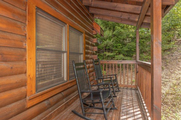 Porch with rocking chairs at Location Location Location, a 1 bedroom cabin rental located in Pigeon Forge