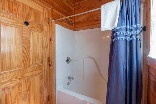 Bathroom with a tub and shower at Ella-Vation, a 3 bedroom cabin rental located in Gatlinburg