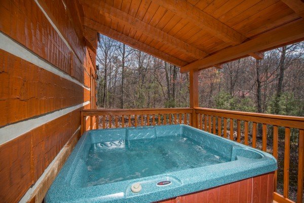 Hot tub on the main floor deck at Ella-Vation, a 3 bedroom cabin rental located in Gatlinburg