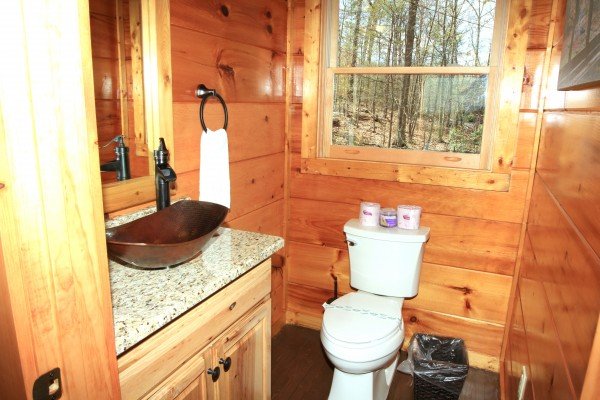 Half bath in the loft at Makin' Honey, a 1 bedroom cabin rental located in Pigeon Forge