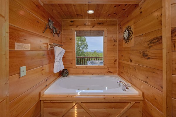Jacuzzi tub at Makin' Honey, a 1 bedroom cabin rental located in Pigeon Forge