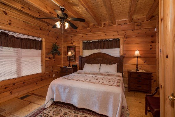 Bedroom with two night stands and lamps at Pigeon Forge View, a 6 bedroom cabin rental located in Pigeon Forge