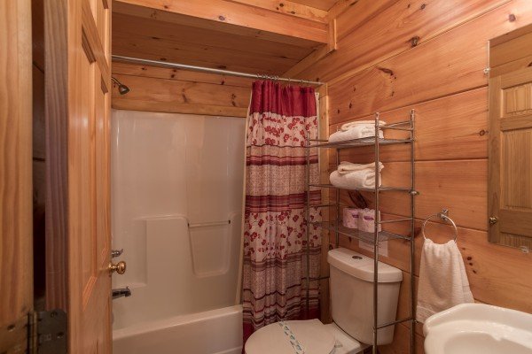 Bathroom with a tub and shower at Pigeon Forge View, a 6 bedroom cabin rental located in Pigeon Forge