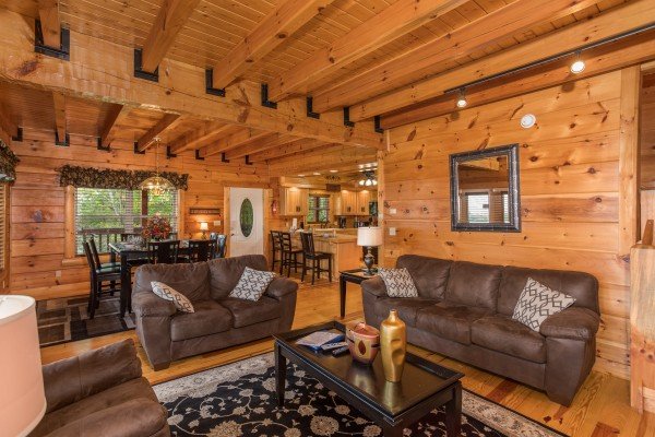 Sofa and loveseat in a living room at Pigeon Forge View, a 6 bedroom cabin rental located in Pigeon Forge