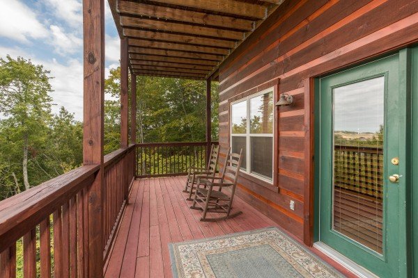 Rocking chairs on a porch at Pigeon Forge View, a 6 bedroom cabin rental located in Pigeon Forge
