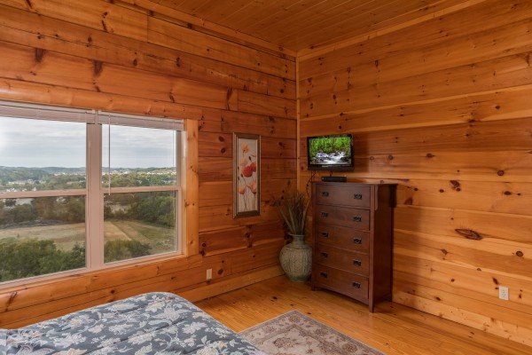 Dresser and TV in a bedroom at Pigeon Forge View, a 6 bedroom cabin rental located in Pigeon Forge