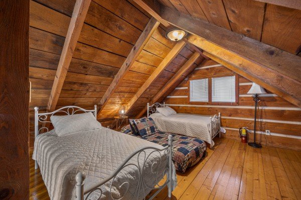 Bedroom with twin beds at Henwood's Hideaway, a 1 bedroom cabin rental located in Pigeon Forge