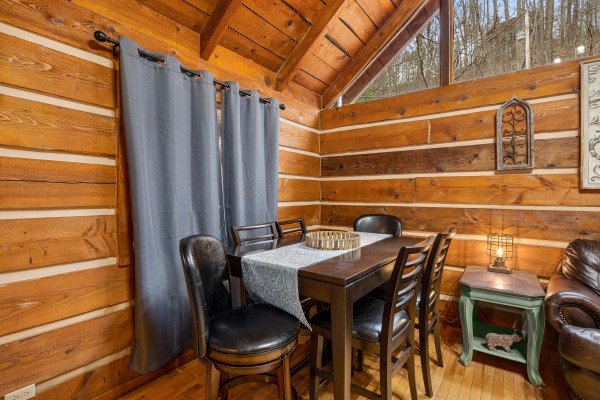 Dining table for 6 at Henwood's Hideaway, a 1 bedroom cabin rental located in Pigeon Forge