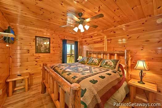 King bedroom with ceiling fan at Tree Top Lodge, a 3 bedroom cabin rental located in Gatlinburg
