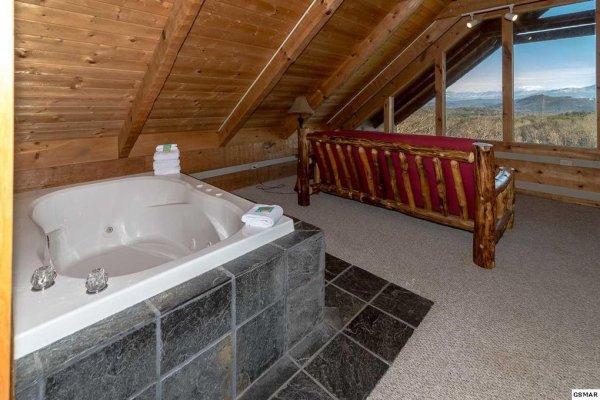 Upstairs Jacuzzi with mountain view at A Room With A View, a 1 bedroom cabin rental located in Pigeon Forge