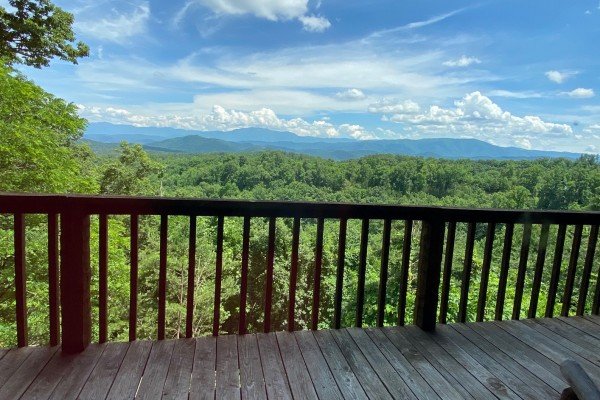 Mountain view from deck with guard rail at A Room With A View, a 1 bedroom cabin rental located in Pigeon Forge