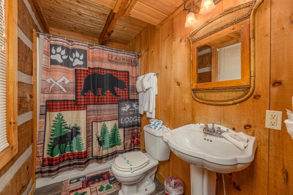 Main floor bathroom at A Room With A View, a 1 bedroom cabin rental located in Pigeon Forge
