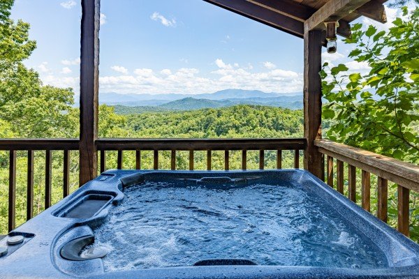 Mountain and tree view from hot tub at A Room With A View, a 1 bedroom cabin rental located in Pigeon Forge 