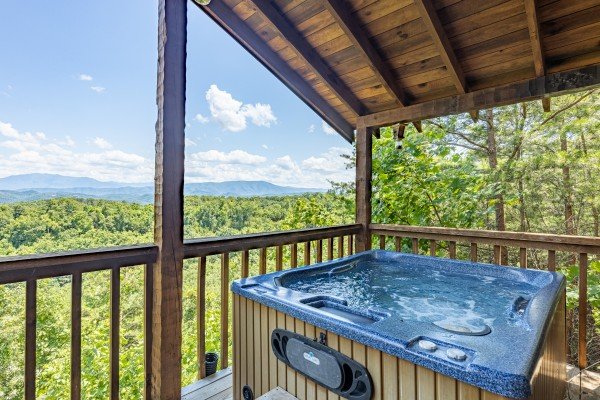 Mountain view from hot tub at A Room With A View, a 1 bedroom cabin rental located in Pigeon Forge 