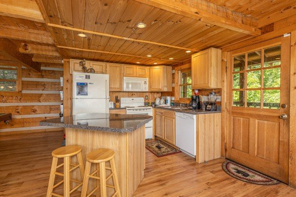Kitchen with breakfast bar at A Room With A View, a 1 bedroom cabin rental located in Pigeon Forge