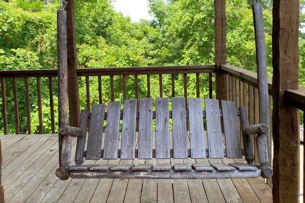Porch swing  at A Room With A View, a 1 bedroom cabin rental located in Pigeon Forge