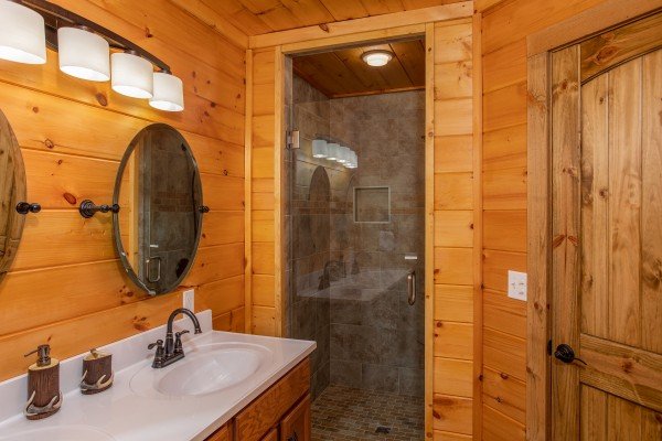Bathroom with a walk in glass shower at Four Seasons Palace, a 5-bedroom cabin rental located in Pigeon Forge