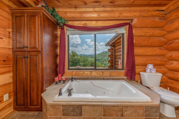 Jacuzzi tub in the bathroom at God's Country, a 4 bedroom cabin rental located in Pigeon Forge