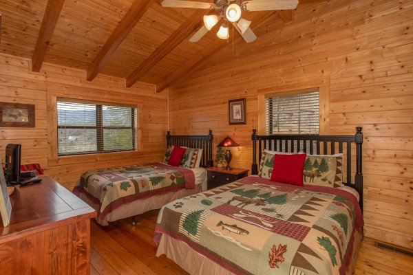 Bedroom with two beds at Let the Good Times Roll, a 2 bedroom cabin rental located in Pigeon Forge